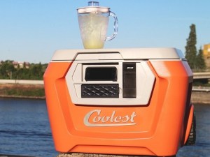 A cooler with a blender and stereo build in.